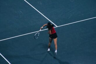 Emma Dong (Georgia) his shot at Magill Tennis Center in Athens, Georgia in match versus Texas A&M in 2026 NCAA Semifinals.