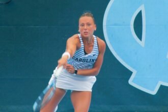 No. 21 Tatum Evans (UNC-CH) serves in her match versus No. 48 Katie Rolls (Virginia) at the Kitty Harrison Invitational Sept. 13, 2026.