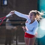 Luciana Perry serves at ITA All American Championships in Cary, NC