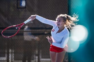 Luciana Perry serves at ITA All American Championships in Cary, NC