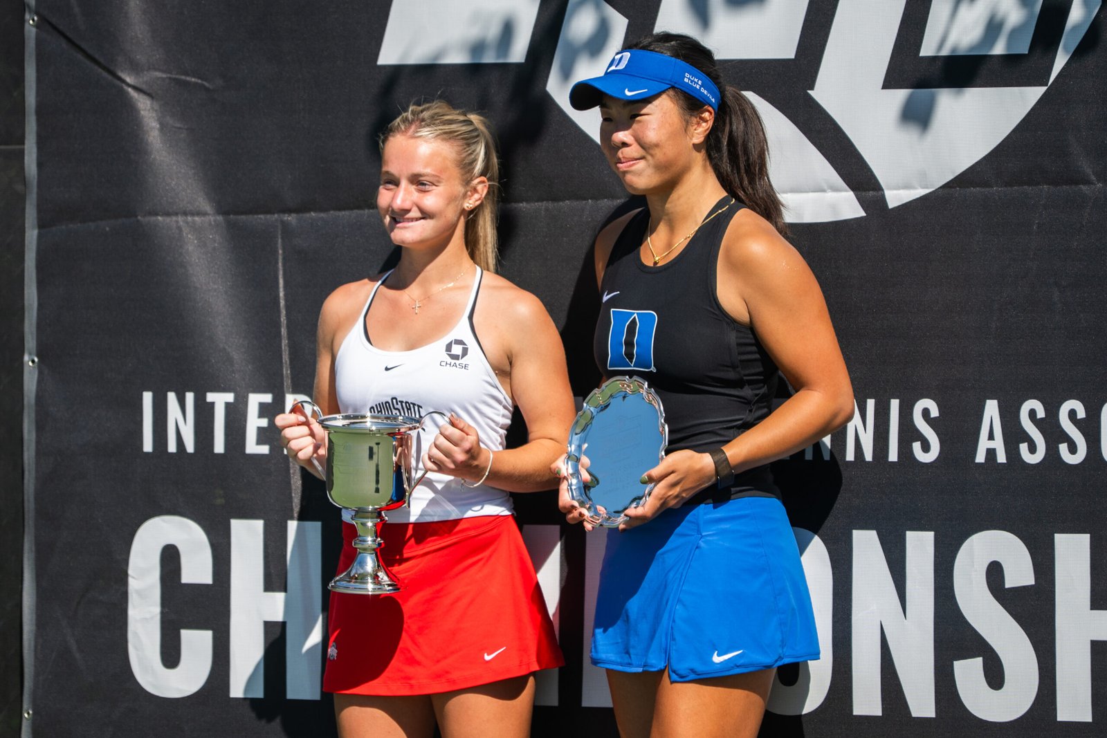 Mimi Xu and Luciana Perry receive trophies for being ITA All Americans finalists.