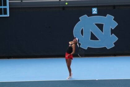 Deniz Dilek serves at Kitty Harrison Invitational