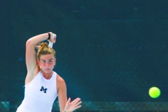 Piper Charney hits ball at Kitty Harrison Invitational