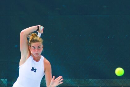 Piper Charney hits ball at Kitty Harrison Invitational