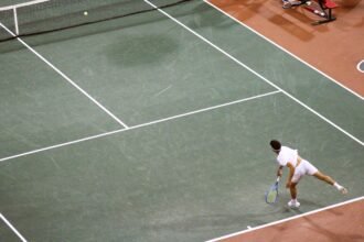 Andres Santamarta Roig serves during NCAA Team Quarterfinals match.