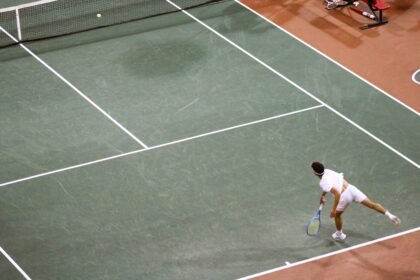 Andres Santamarta Roig serves during NCAA Team Quarterfinals match.