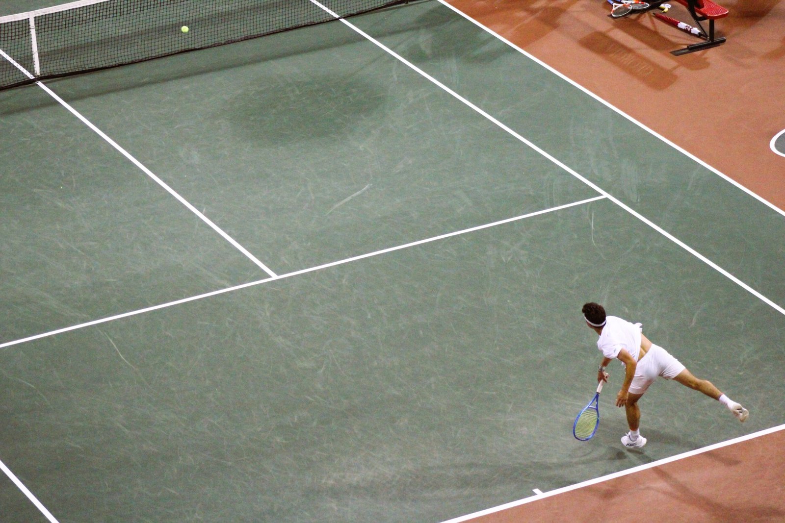 Andres Santamarta Roig serves during NCAA Team Quarterfinals match.